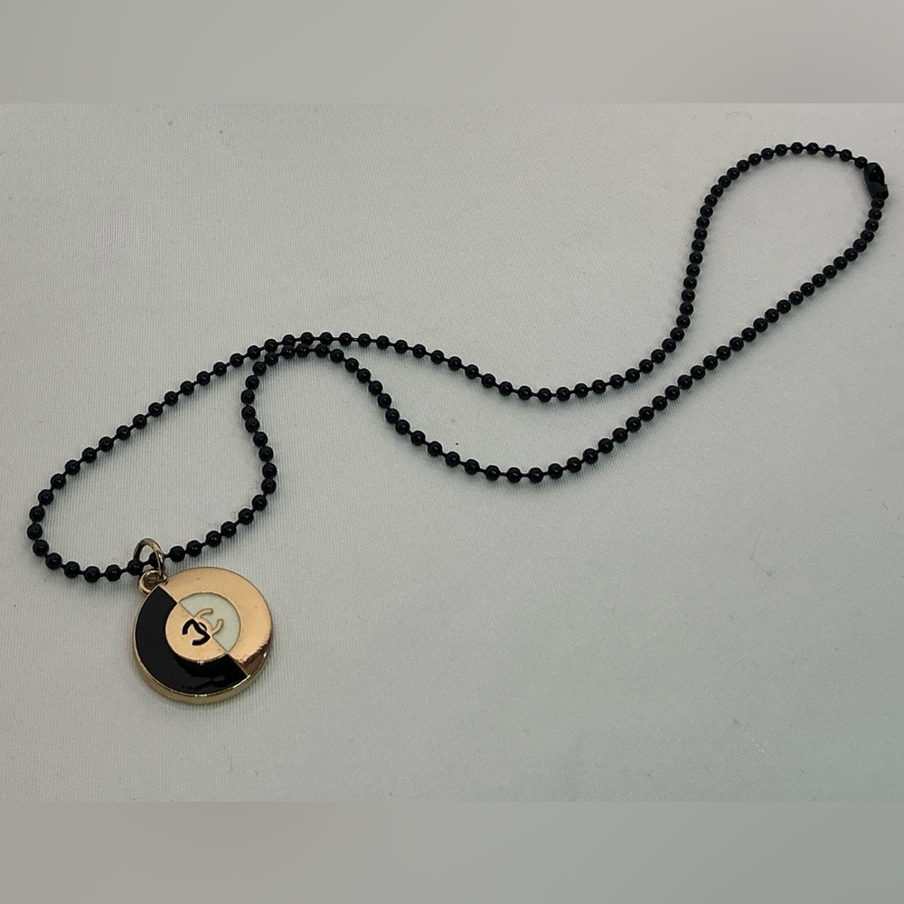 CHANEL Two-Tone Pendant Black and Gold Necklace
